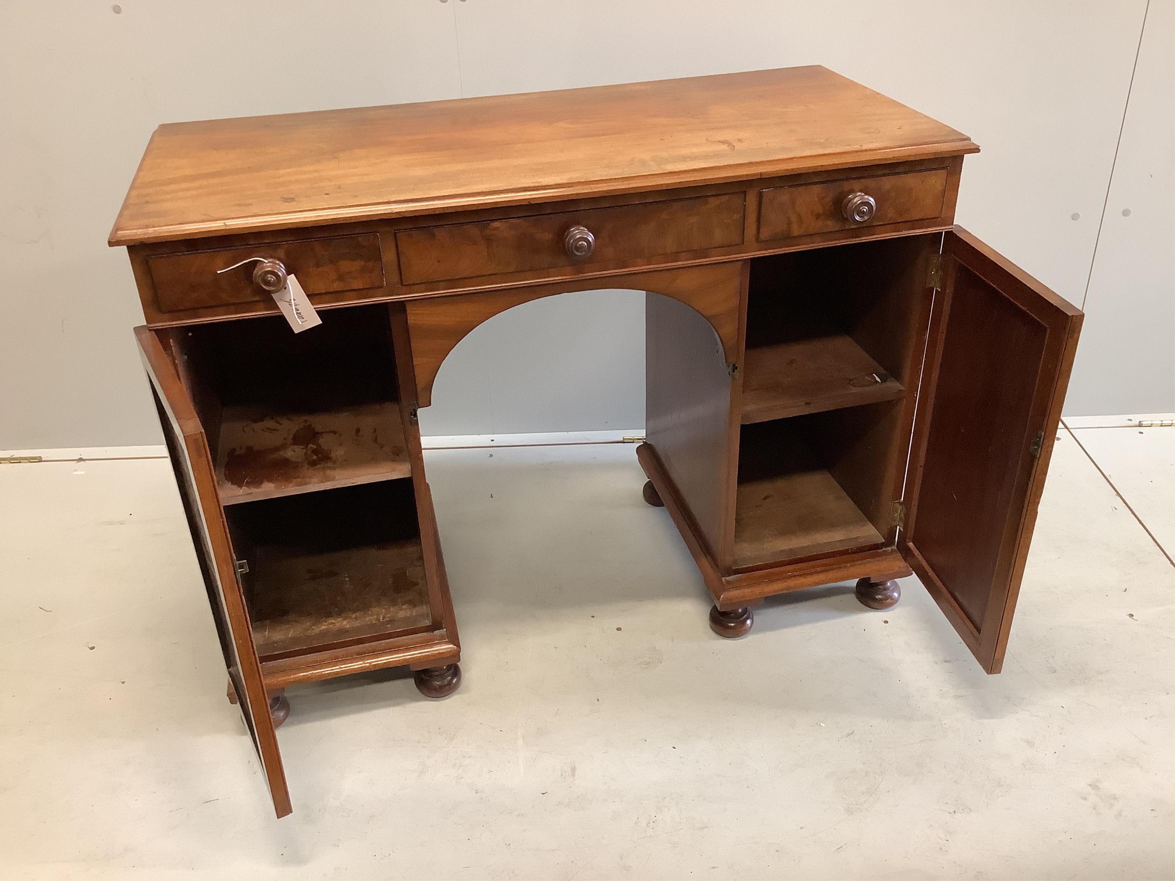 An early Victorian mahogany kneehole dressing table, width 107cm, depth 48cm, height 79cm. Condition - fair